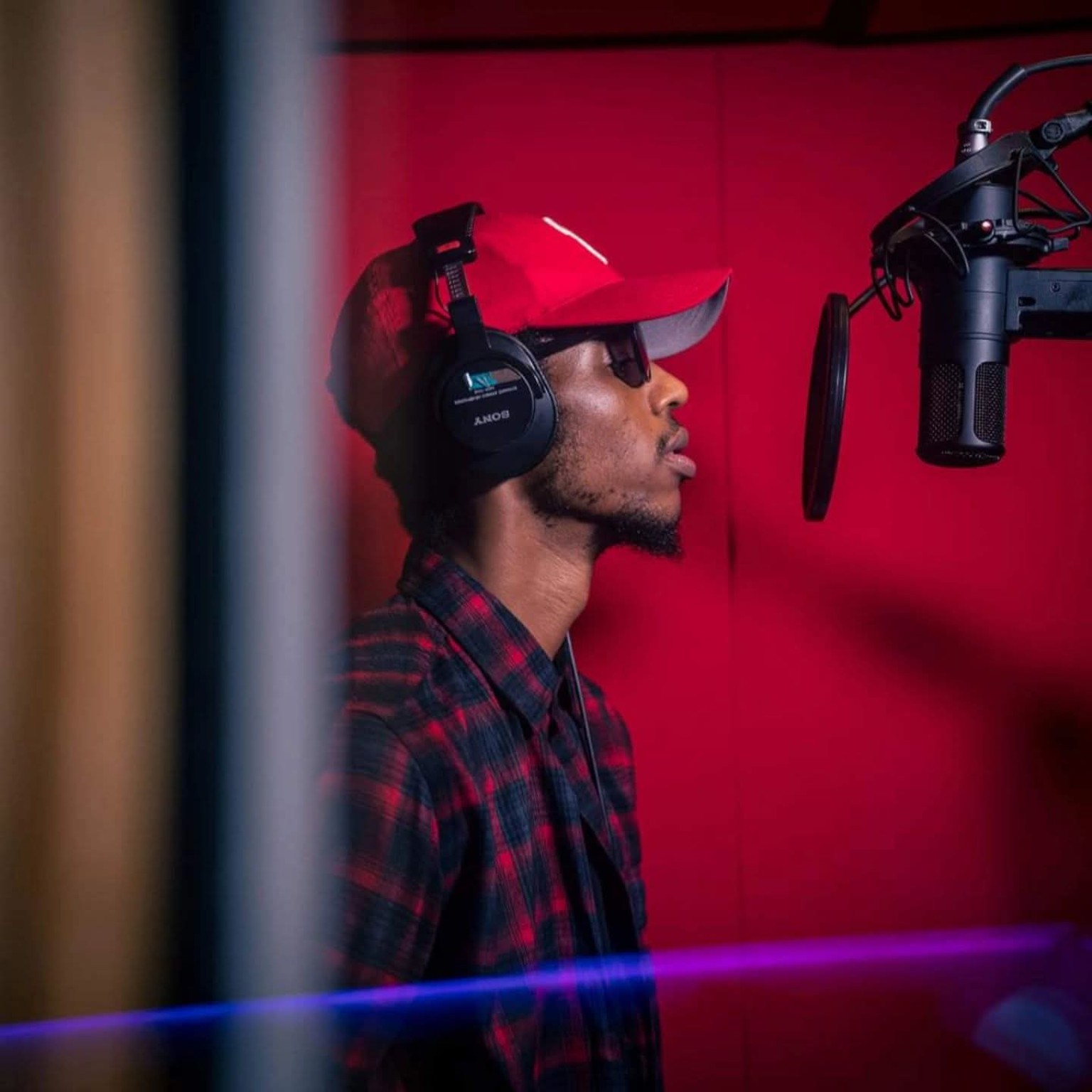 Reefa Ali recording vocals in the studio